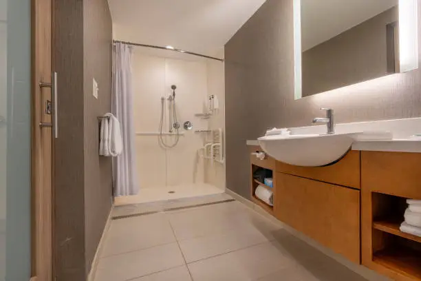 Bathroom with zero-threshold shower and slip-resistant flooring.