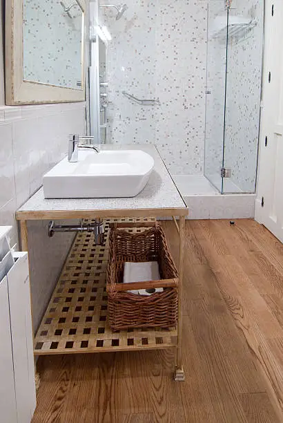 Bathroom with recycled quartz countertop and bamboo flooring.