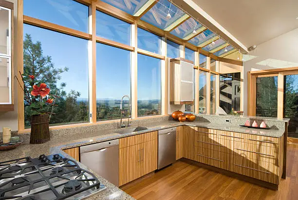 Kitchen with large windows and passive solar design.