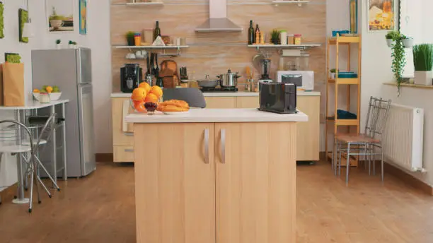 Open-concept small kitchen with compact appliances and foldable island.