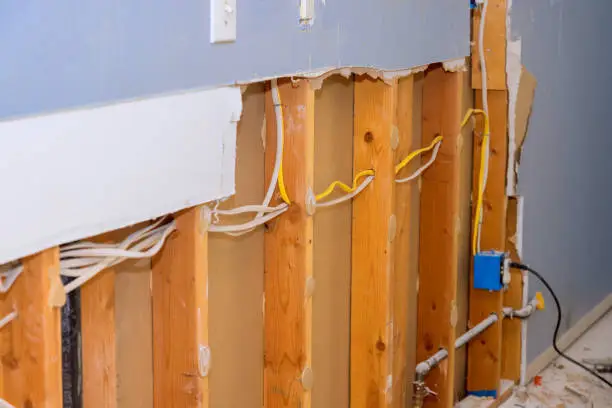 Kitchen remodel in progress with shielded wiring and backup power installation.