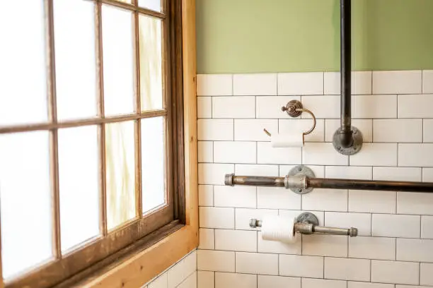 Bathroom with salvaged fixtures and reclaimed wood accents.