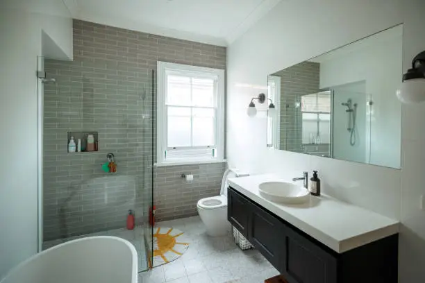 Bathroom with flood-resistant tiles and sealed fixtures.