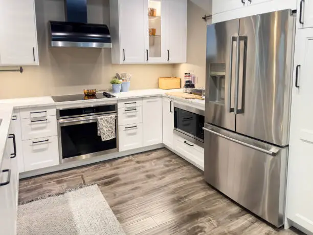 Kitchen with marble countertops and hardwood flooring.