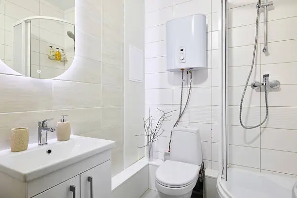 Bathroom with tankless water heater and radiant flooring.