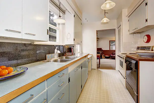 Outdated kitchen with old fixtures contrasted with a modern KBR remodel.