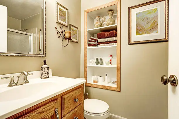 Small bathroom with built-in niches and pull-out pantry in a kitchen.