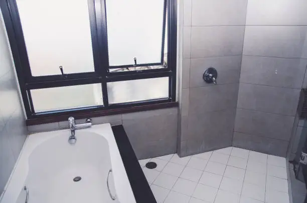 Bathroom with moisture-resistant tiles and insulated plumbing, designed for high-altitude conditions.