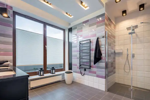 Bathroom with heated floors and spring-inspired pastel fixtures.