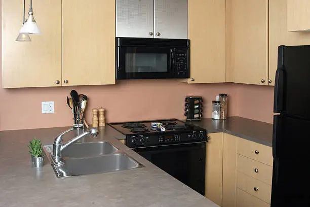 Kitchen with cramped counter space and poor appliance placement.