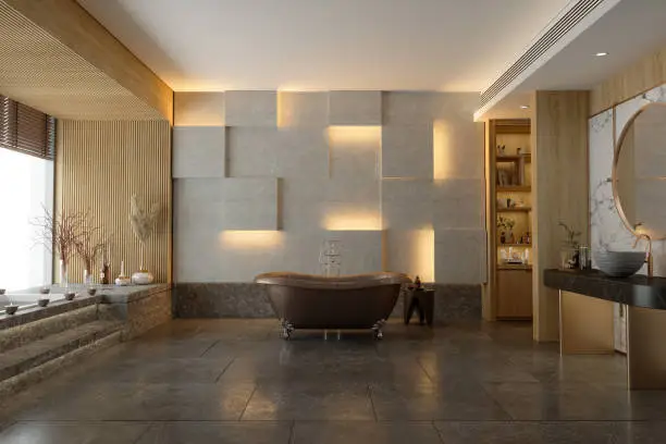 Bathroom with natural stone tiles and calming lighting.