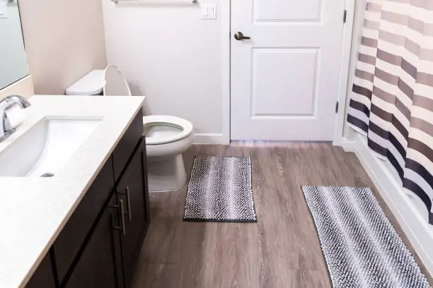 Bathroom with non-slip flooring and waterproof fixtures.