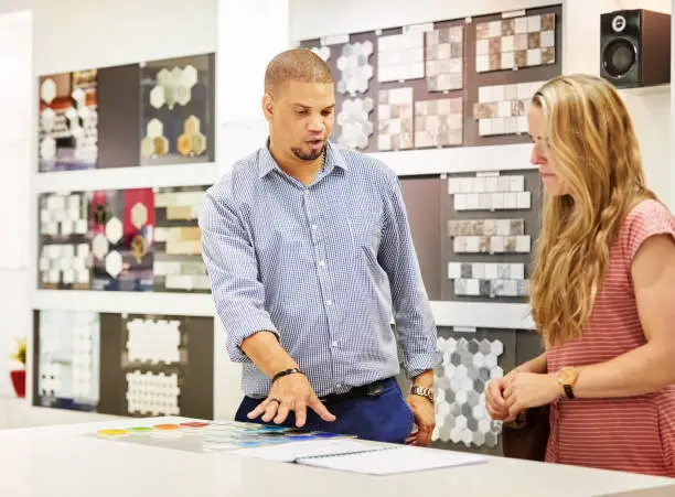 KBR contractor discussing budget-friendly design in a showroom