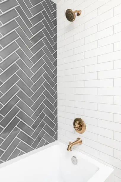 Dual remodel with cohesive tiles and coordinated fixtures