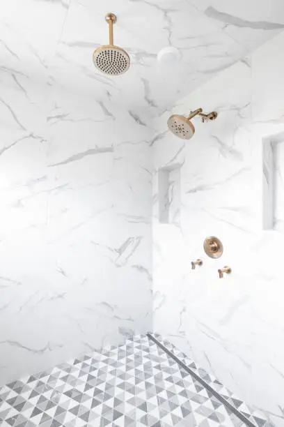 Dual remodel with cohesive fixtures and tiles in both spaces