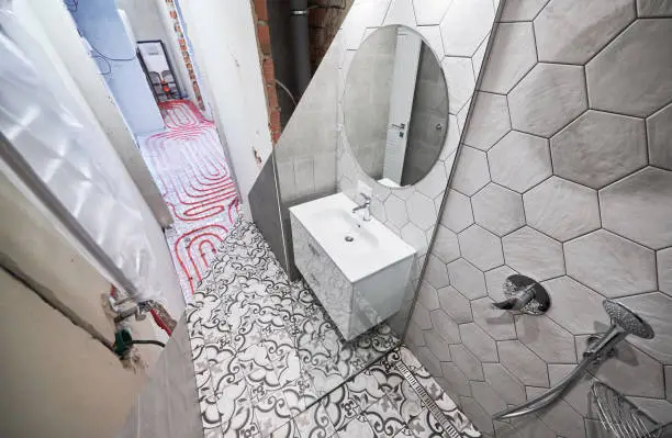 Bathroom with heated floors and water-saving smart faucets.