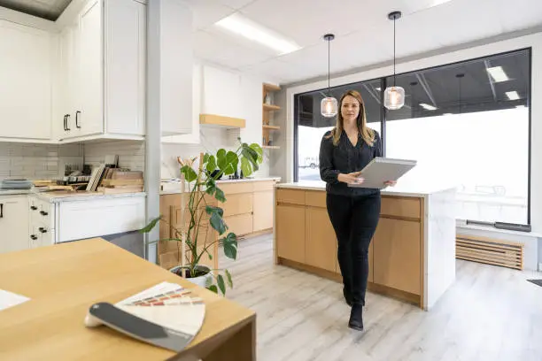 Contractor showcasing a culturally inspired kitchen design in a showroom.