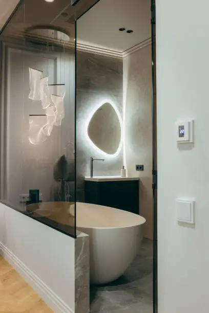 Bathroom with smart mirror and concealed audio system.