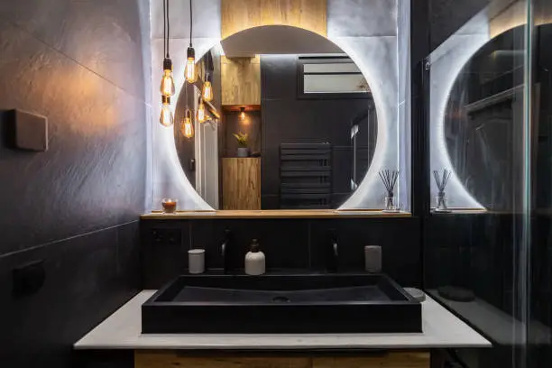 Bathroom with backlit mirrors and waterproof LEDs