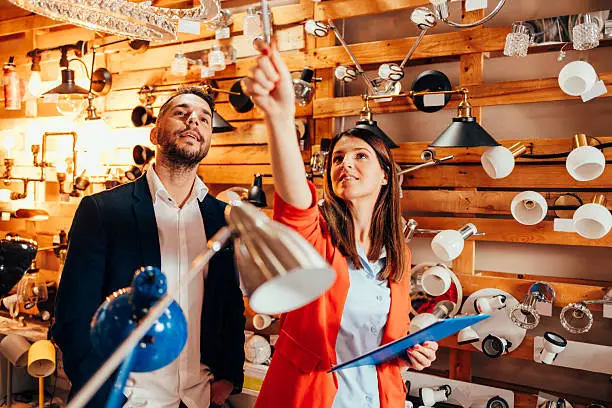 KBR contractor discussing lighting plans in a showroom