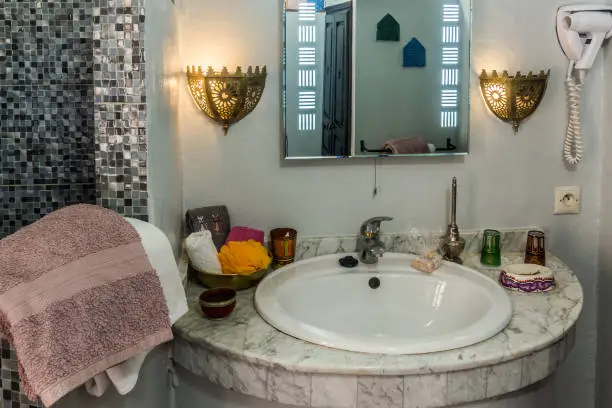  Bathroom with Moroccan mosaic tiles and Indian marble accents.