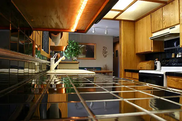 Kitchen with heat-reflective tiles and off-grid appliances.