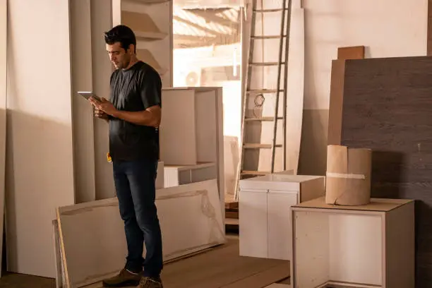 KBR contractor reviewing digital remodel plans in a showroom