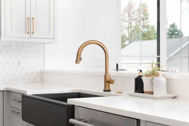 Kitchen with hands-free faucets and smart lighting