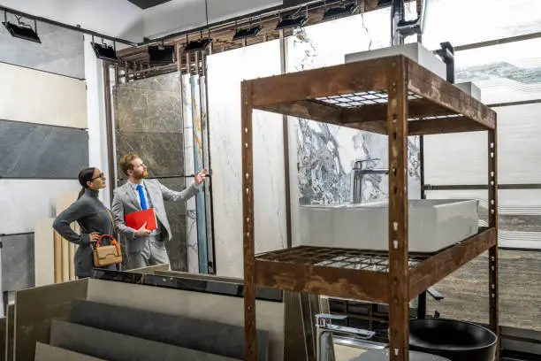 KBR contractor reviewing restoration plans in a showroom