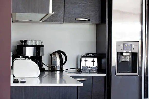 Kitchen with prefabricated countertops and temporary appliances