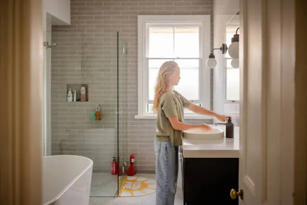 Bathroom with water-saving fixtures and recycled tiles