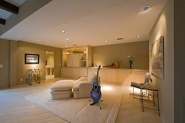 Basement media room with wet bar and soundproofing
