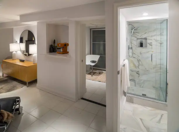 Basement with compact kitchenette and spa-inspired bathroom