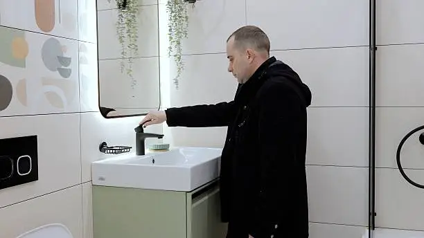 KBR contractor reviewing bathroom design in a showroom.