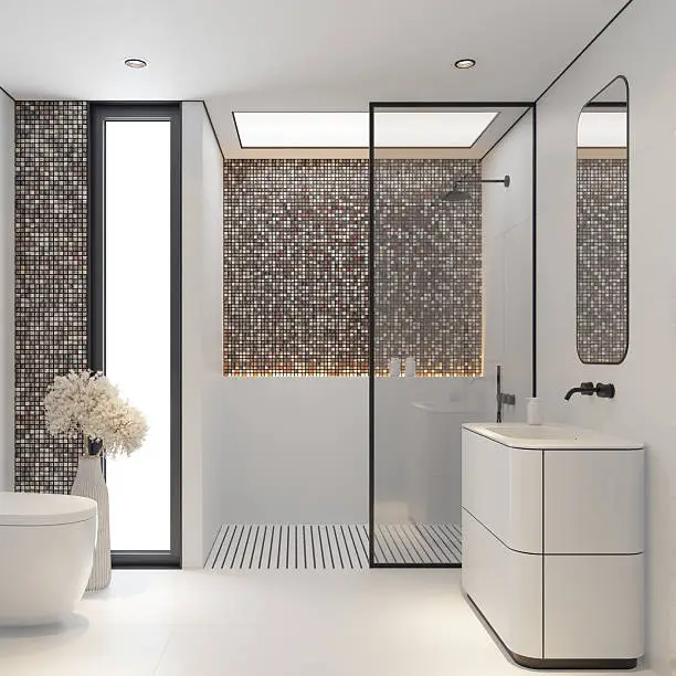 Bathroom with matte black faucets and mosaic tiles.