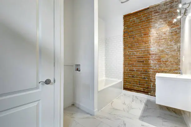 Bathroom with rebuilt walls and fresh finishes