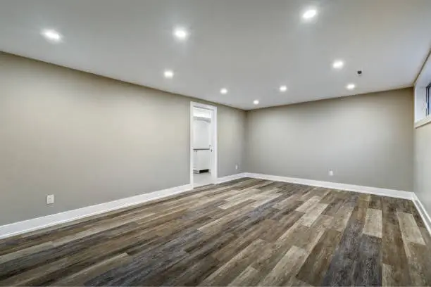 Basement with guest suite and moisture-resistant flooring.