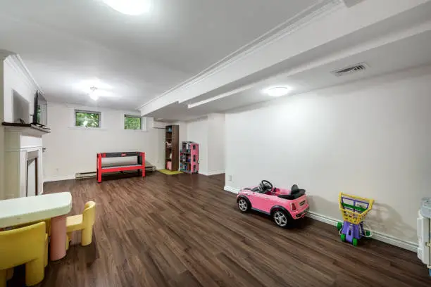 Basement playroom and gym with resilient flooring.